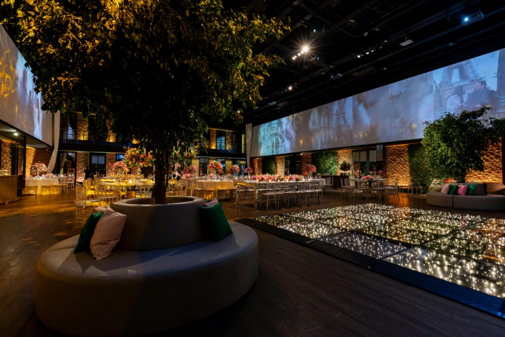 Luxurious indoor wedding reception with elegant decor and ambient lighting.